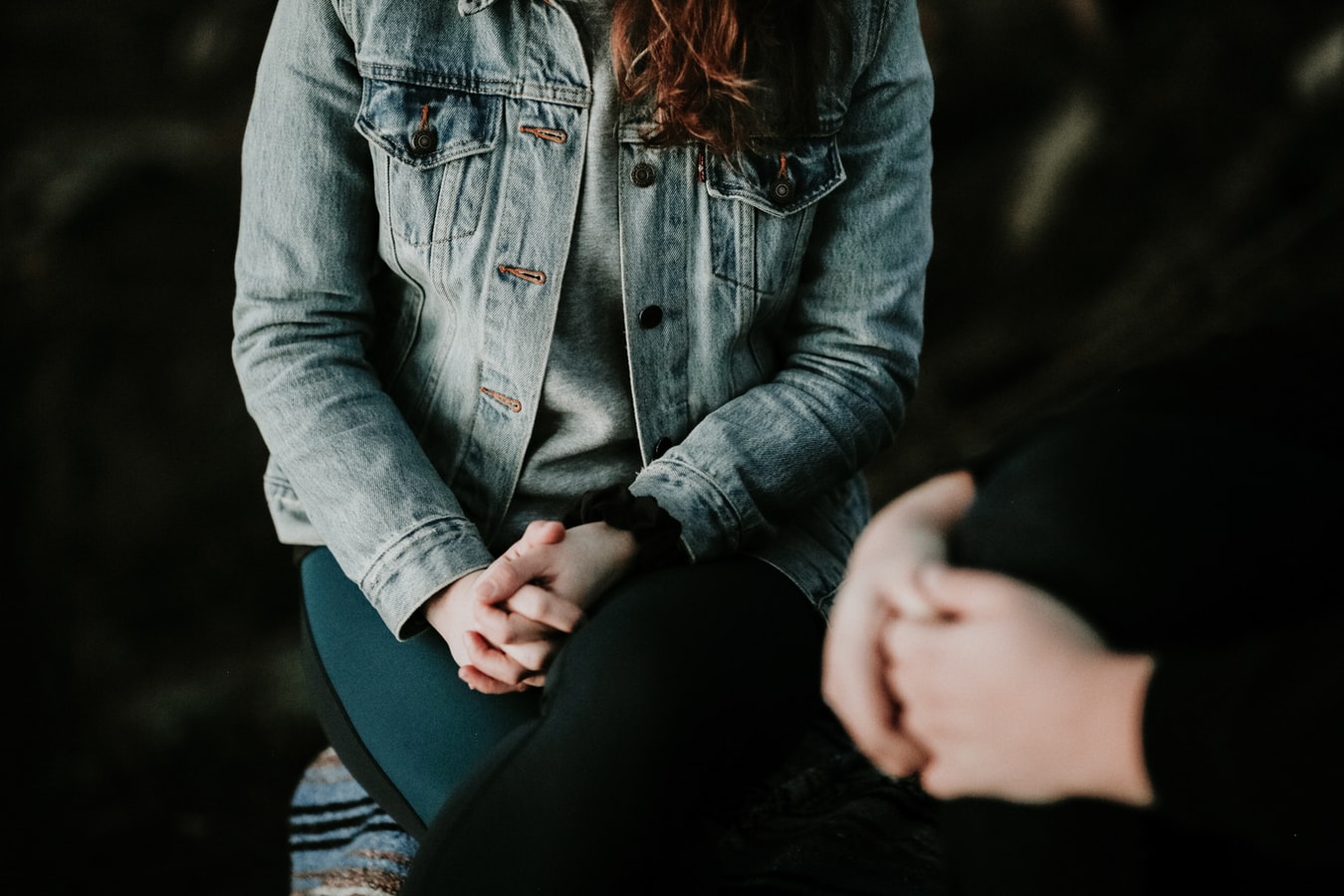 Photo of young woman in a counseling session with a counselor 